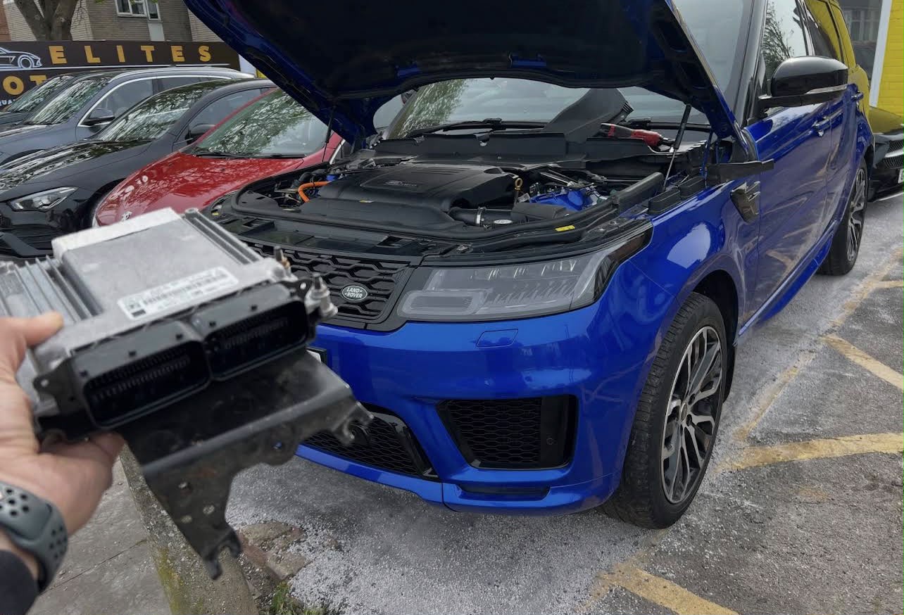 Range Rover Sport ECU removed for remapping on a driveway