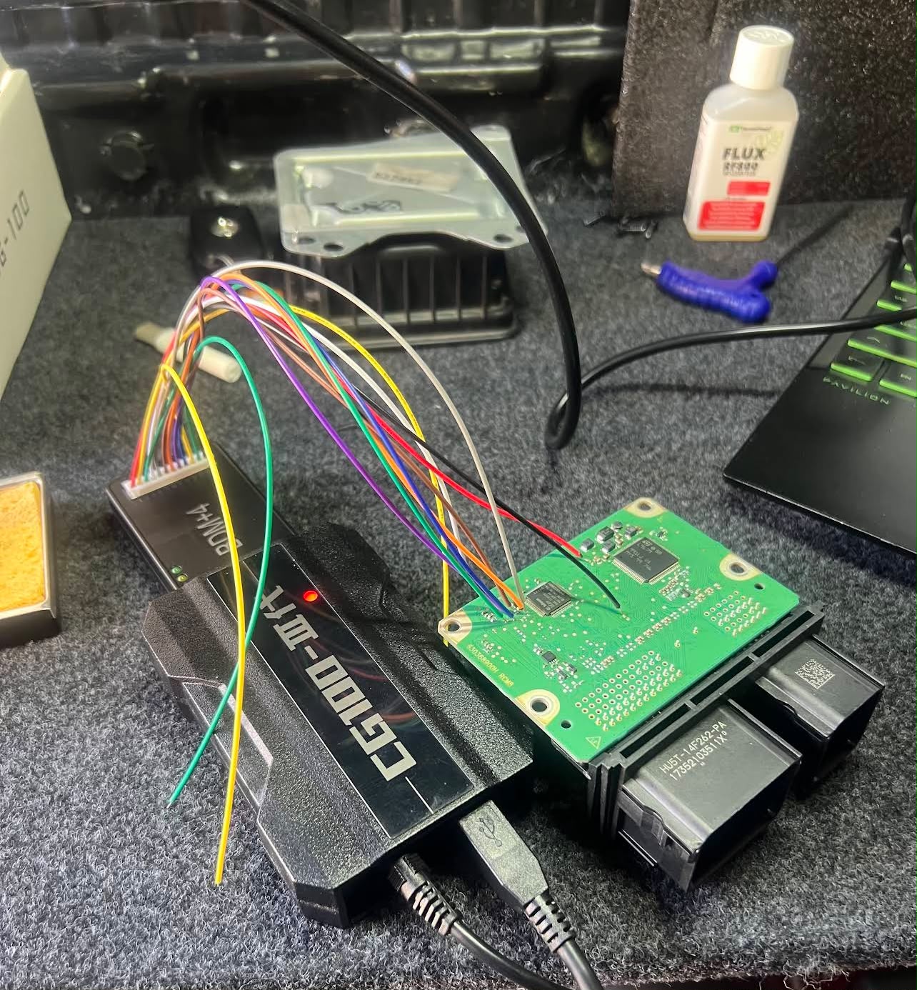 CG100 bench setup on ECU circuit board